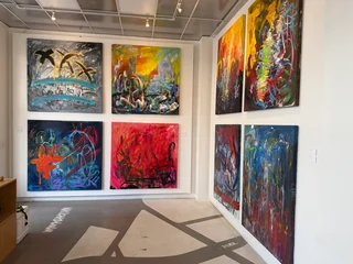 Paintings arranged around a corner of Kaiao Space